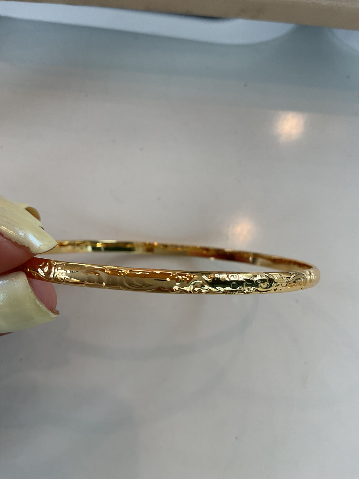 Gold stainless steel Bali artisan design round bangle bracelet